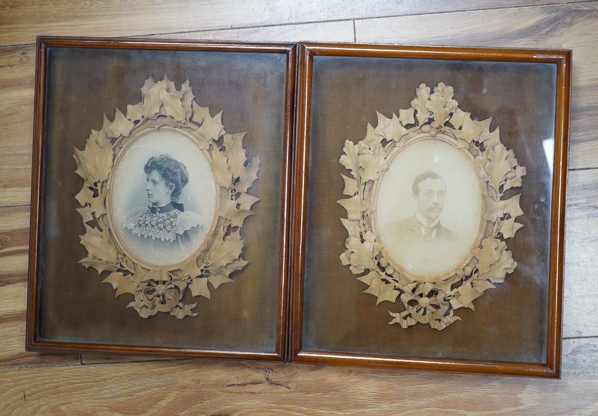 Two photograph frames, finely carved by Alfred Jones, see reverse of both, Margaret Edmondson frame 25cm wide x 30cm high. Condition - good